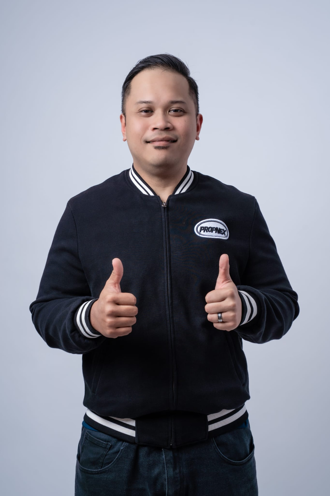 Husaini Salamat giving a thumbs up.